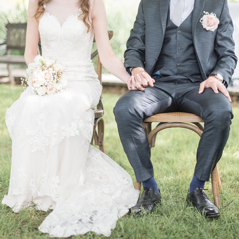 Bride and groom sitting at French wedding ceremony